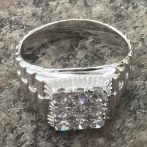 Silver tone with diamond like stones..large men’s